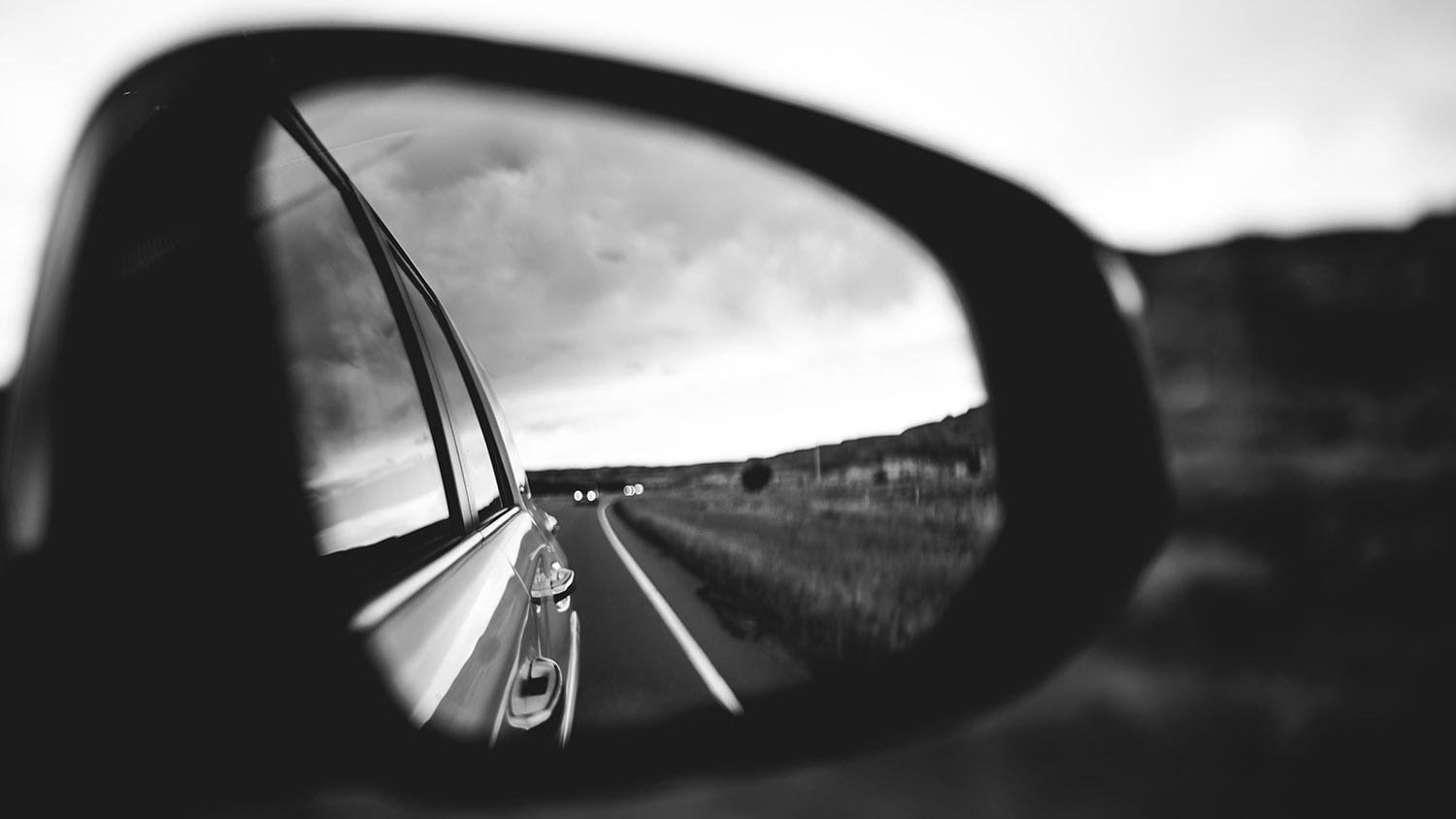 back view in the side mirror, desolate landscape