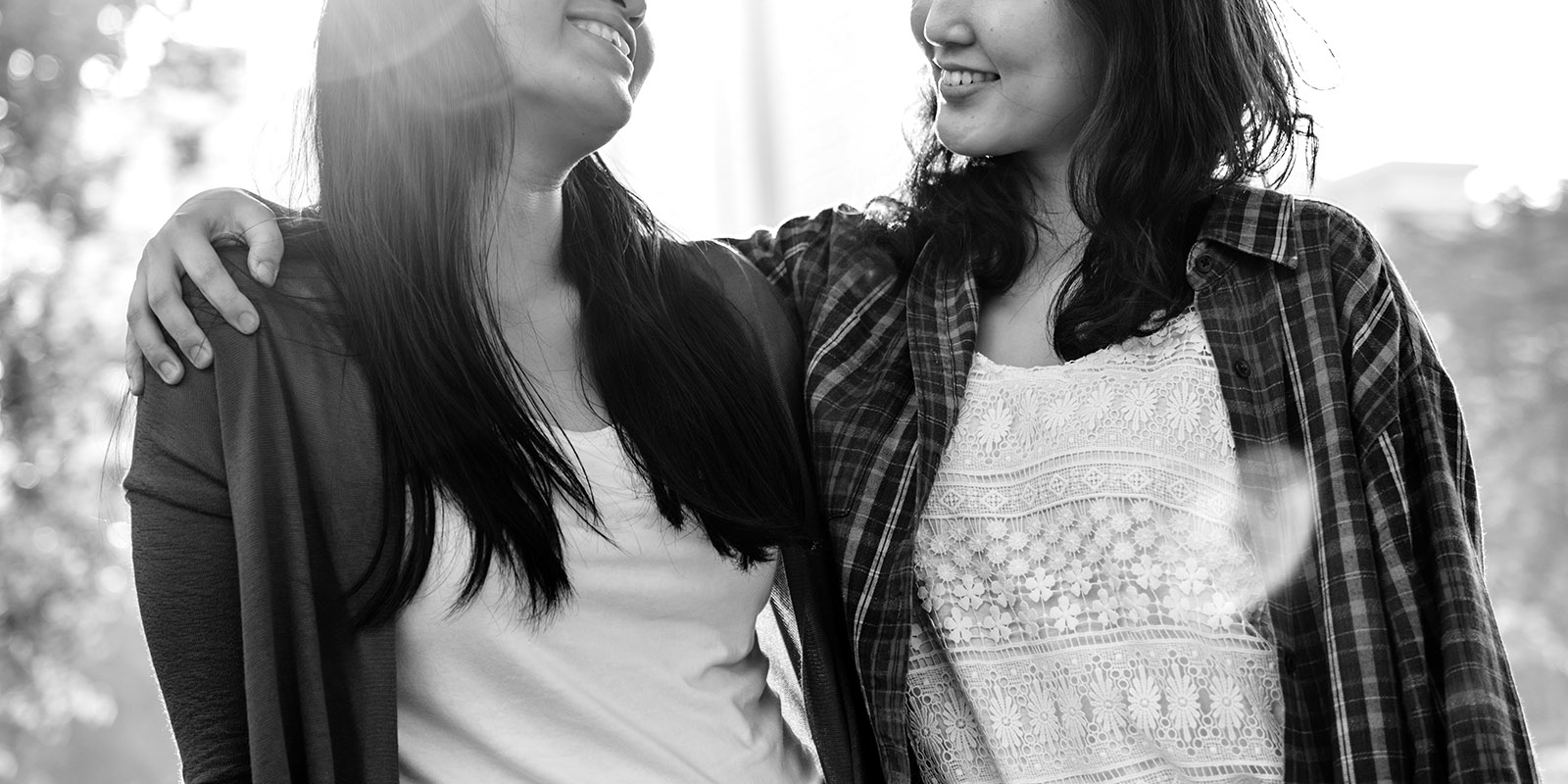 Sisters embracing and smiling