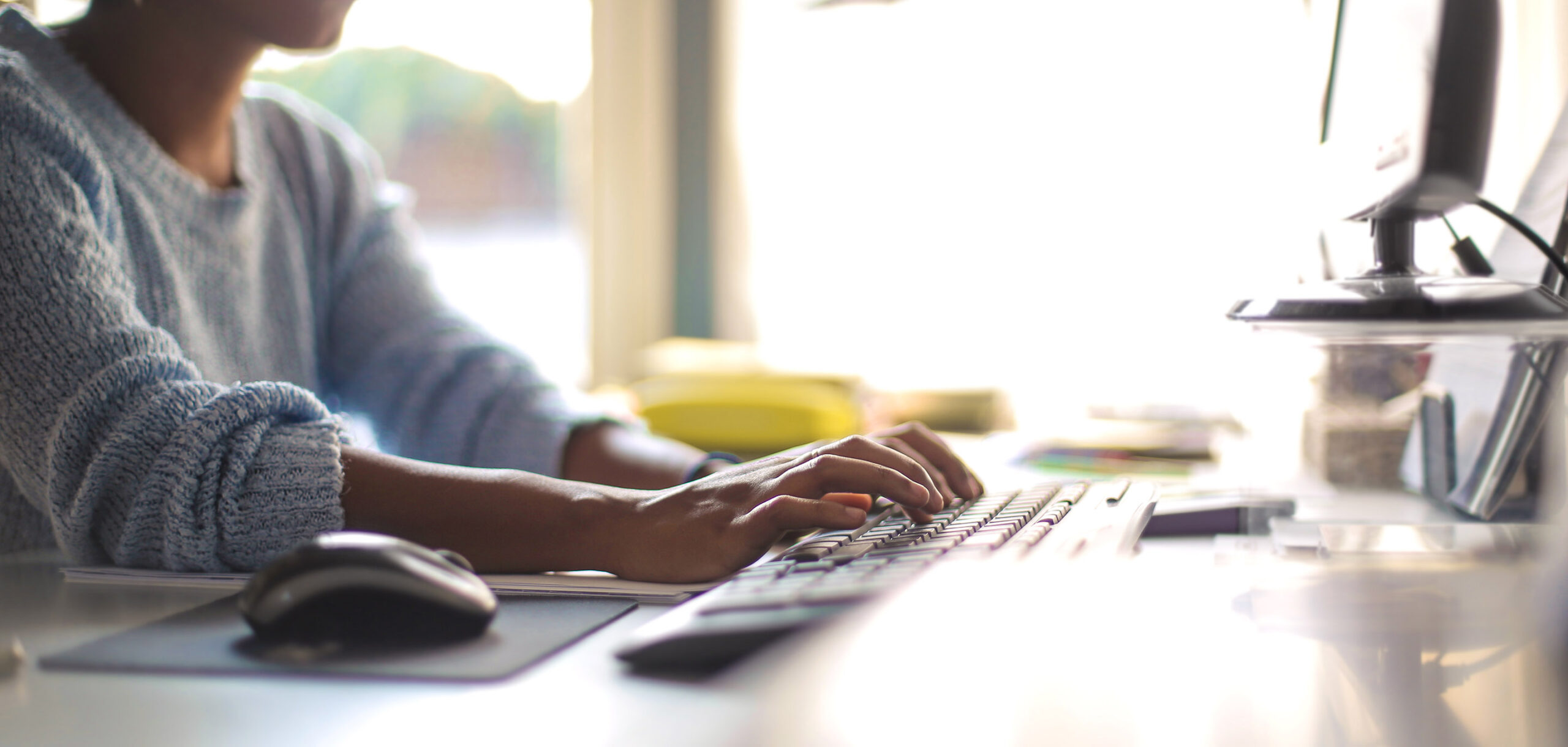 Woman typing on the keyboard